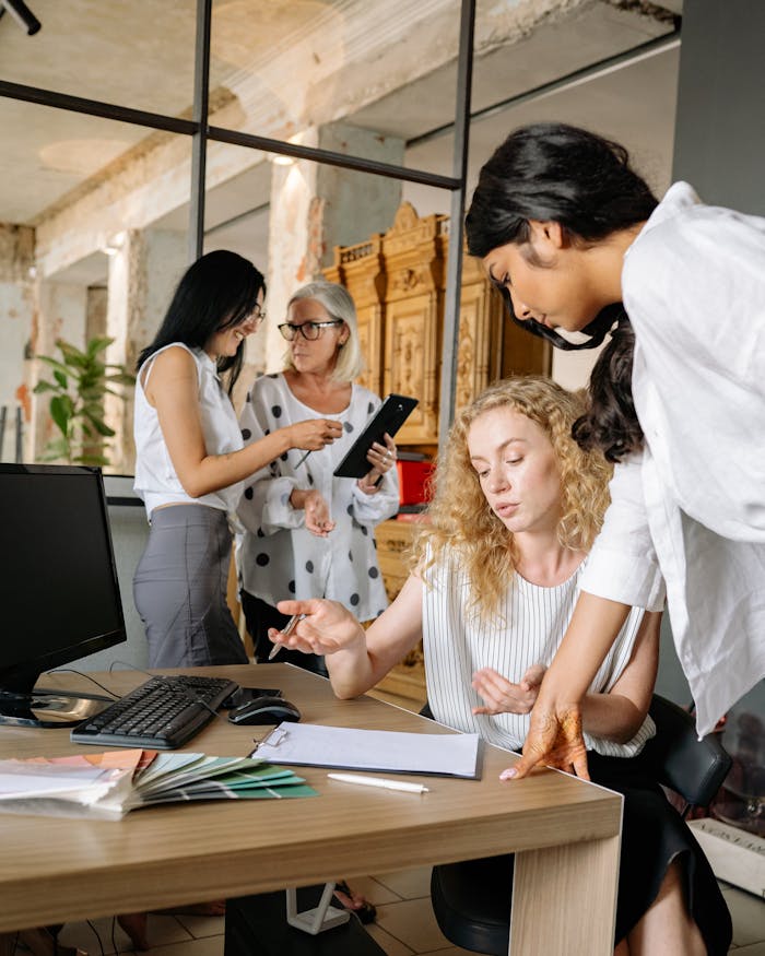 Diverse team of businesswomen collaborating in a modern office setting.